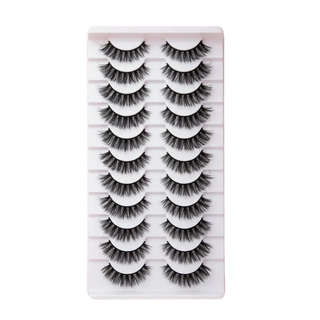 Set of false eyelashes on a white card with a grid pattern