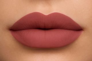 Close-up of a person's lips wearing a matte lipstick
