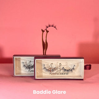 Eyelash packaging with 'Ayesha Sabina' branding on a pink background