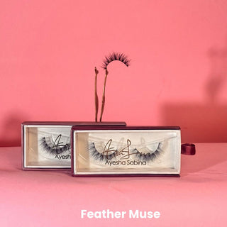 Eyelash packaging with 'Ayesha Sabina' branding on a pink background