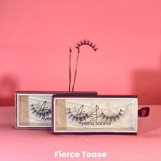 Eyelash packaging with 'Ayesha Sabina' branding on a pink background