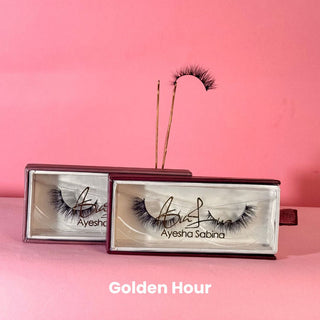 Eyelashes in branded boxes on a pink background with 'Golden Hour' text.