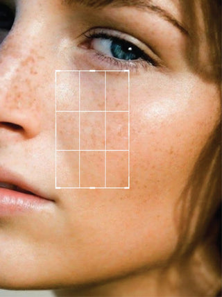 Close-up of a person's face with a grid overlay
