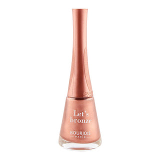 Rose gold Bourjois nail polish bottle with 'Let's Bronze' text on a white background