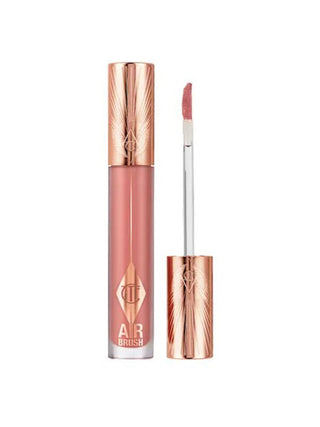 Lip gloss with rose gold cap and clear case on white background