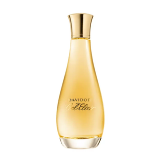 Perfume bottle with gold cap and label on a white background