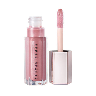 Fenty Beauty lip gloss with applicator on a white background