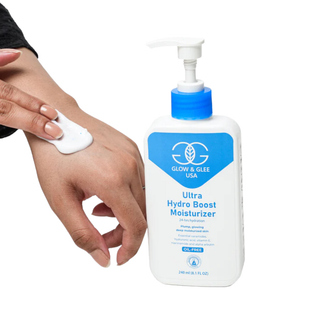 Glow & Glee Ultra Hydro Boost Moisturizer bottle with a hand applying the product.