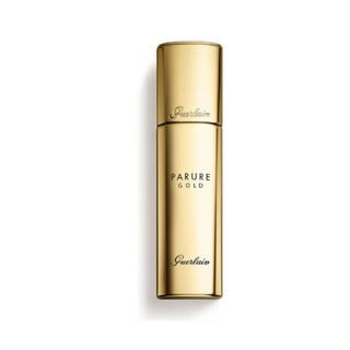 Gold Guerlain Parure Gold cosmetic bottle on a white background