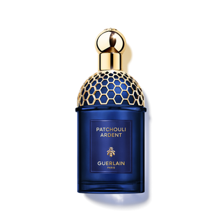 Guerlain Patchouli Ardent perfume bottle with blue body and gold cap on a white background