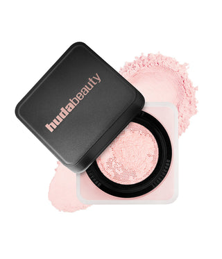 Huda Beauty compact powder with pink blush on a white background