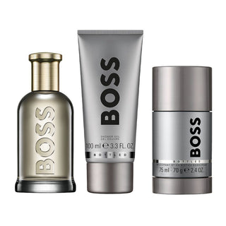 BOSS perfume set with a bottle, shower gel, and deodorant stick on a white background