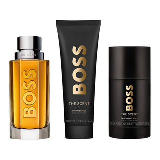 BOSS The Scent perfume, shower gel, and deodorant stick on a white background