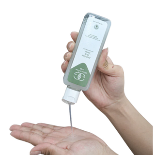 Hand holding a skincare product with a white background