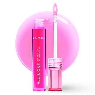 Pink lip oil with applicator on a white background