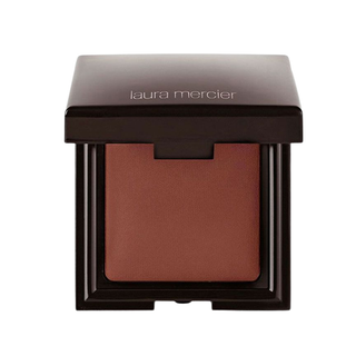 Laura Mercier blush in a compact case on a white background