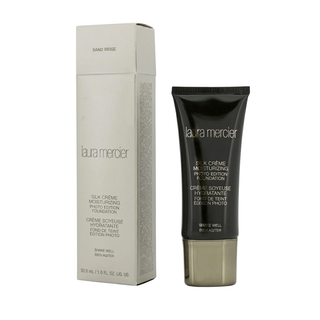 Laura Mercier makeup product and packaging on a white background