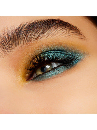 Close-up of a eye with teal and brown makeup