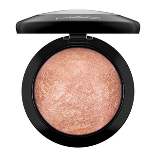MAC compact powder with a pinkish-beige shade on a white background