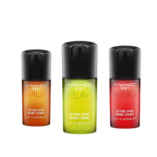 Three MAC setting spray bottles in different colors on a white background