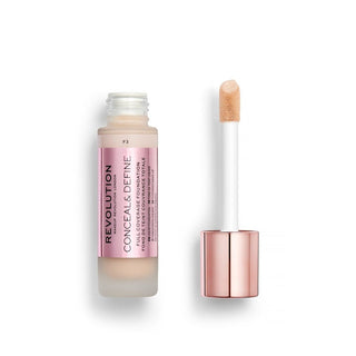 Revolution makeup concealer with applicator on a white background