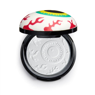 Compact powder with colorful lid on a white background