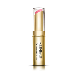 Max Factor Lipfinity lipstick in gold packaging on a white background