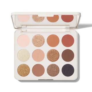 Makeup palette with various shades of eyeshadows on a white background