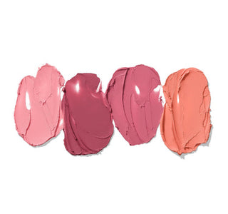 Four swatches of pink and coral lipsticks on a white background