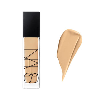 NARS foundation bottle with black cap and a swatch of beige foundation on a white background
