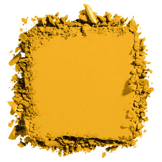 Yellow makeup powder compact with scattered powder on a white background