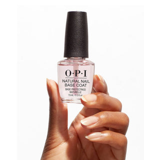 OPI nail polish bottle held by a hand with a white background