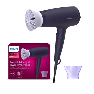 Philips hair dryer with packaging and attachments on a white background