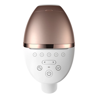 White and rose gold electronic device with control buttons on a white background