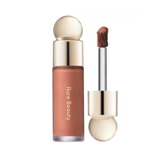 Lip gloss with applicator and 'Rare Beauty' branding on a white background