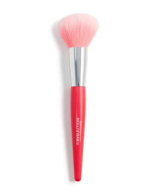Makeup brush with pink bristle head and red handle on a white background