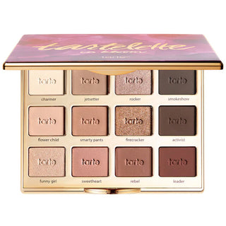 Tartelette palette with multiple shades of makeup on a white background