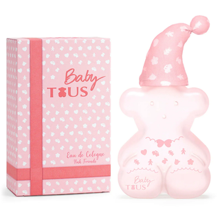 Pink baby bottle-shaped perfume bottle with matching packaging on a white background