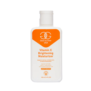 Vitamin C brightening moisturizer bottle with orange label on a white background