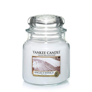 Yankee Candle 'Angels Wings' candle in a clear jar on a white background