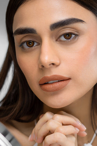 Close-up of a woman's face with a neutral expression