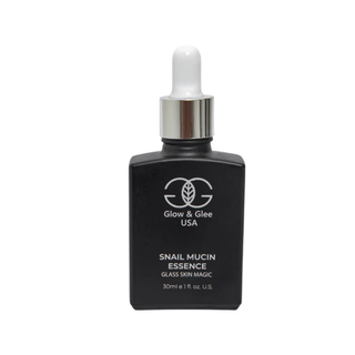 Black bottle of snail mucin essence with dropper labeled 'Glow & Glee USA' on a white background